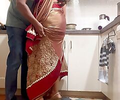Indian Couple Romance on every side the Scullery - Saree Sex - Saree lifted up and Ass Spanked