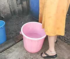 Anita yadav bathing outside with hot aggravation