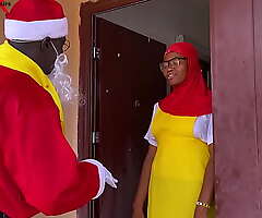 Nigeria Santa Claus interchanges gift with a college girl who simply returned from boarding school nearby spend Christmas holidays